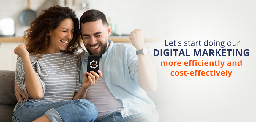 Happy Couple Viewing Smartphone on Couch Knowing They're Doing Digital Marketing Efficiently and Cost-Effectively