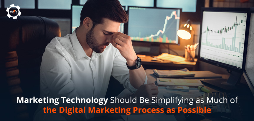 Frustrated Man in Front of Computer Desk Thinking Marketing Technology Should Simplify the Digital Marketing Process