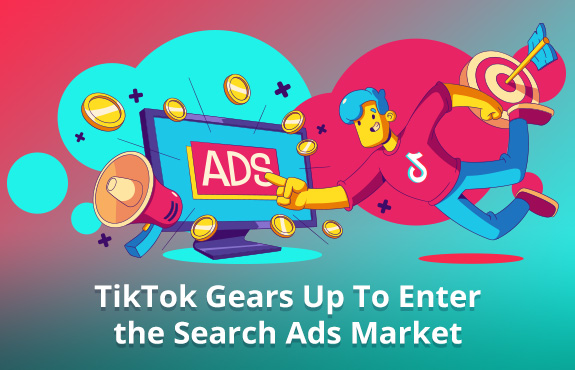 Person Wearing TikTok Shirt Pointing to Ads On Computer Representing TikTok Entering the Search Ads Market